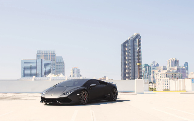 Black sports car city skyline free wallpaper for desktop - medium preview image