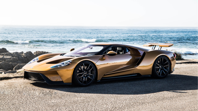 Gold sports car beach ocean free wallpaper for desktop - medium preview image