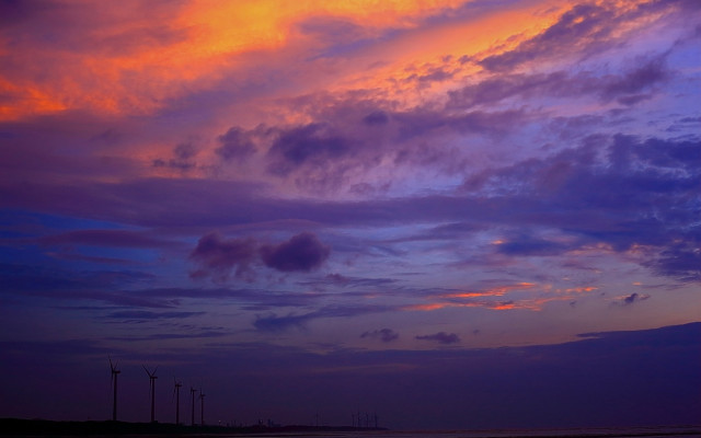 Sunset clouds windmills cityscape ocean free wallpaper for desktop - medium preview image