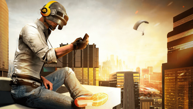 Man helmet sitting cityscape skyscraper free wallpaper for desktop - medium preview image