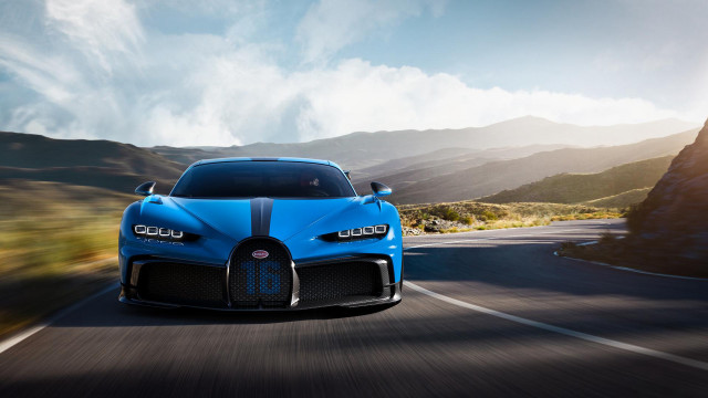 Blue bugatti mountains clouds sunset free wallpaper for desktop - medium preview image