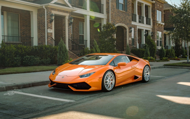 Bright orange sports car residential free wallpaper for desktop - medium preview image