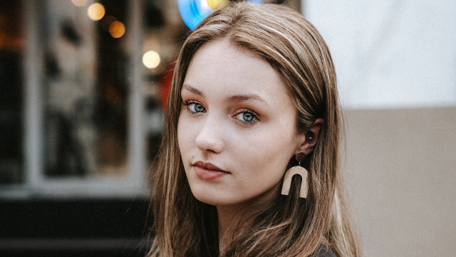 Woman longhair earrings serious look free wallpaper for desktop - medium preview image