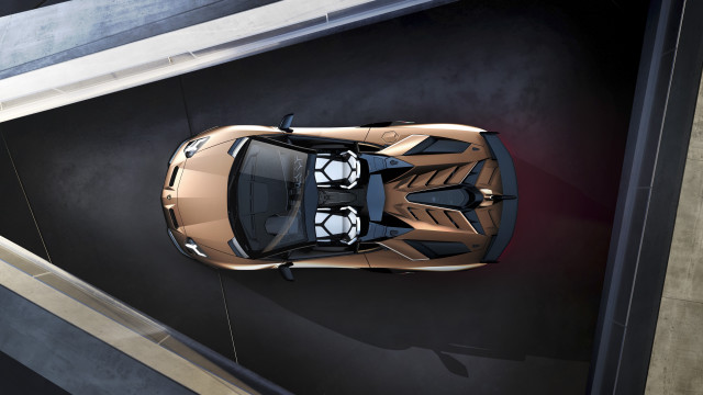 Gold sports car above parking free wallpaper for desktop - medium preview image