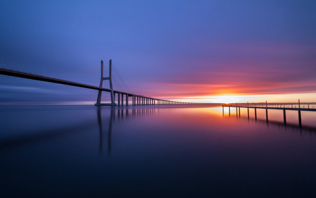 Sunset bridge water orange sky free wallpaper for desktop - medium preview image