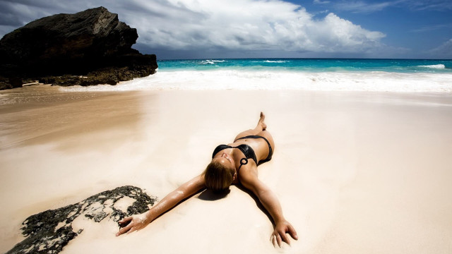 Woman beach bikini sand water free wallpaper for desktop - medium preview image