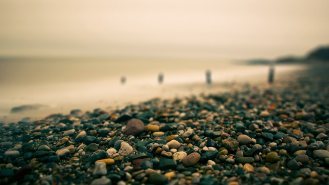 Beach rocks gravel water people free wallpaper for desktop - medium preview image