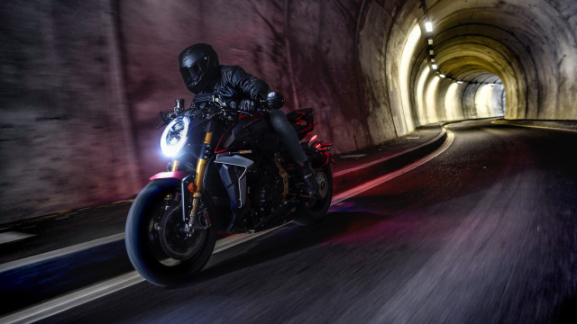 Man motorcycle tunnel helmet panfuturism free wallpaper for desktop - medium preview image