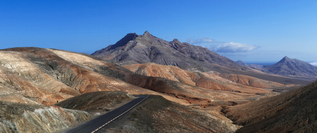 Mountain road landscape cloudy sky free wallpaper for desktop - medium preview image