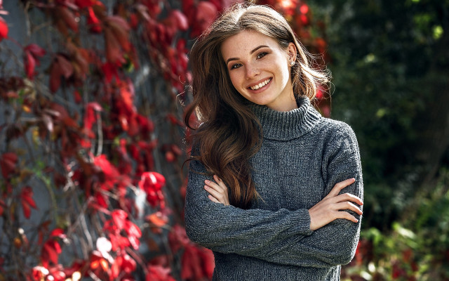 Woman smiling crossed arms christmas free wallpaper for desktop - medium preview image