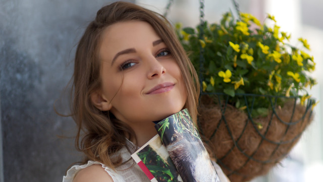 Woman holding plant coffee smiling free wallpaper for desktop - medium preview image