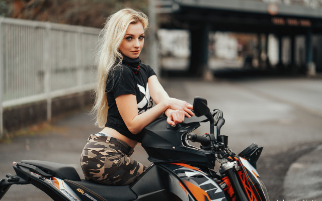 Woman motorcycle sitting bokeh blurry free wallpaper for desktop - medium preview image