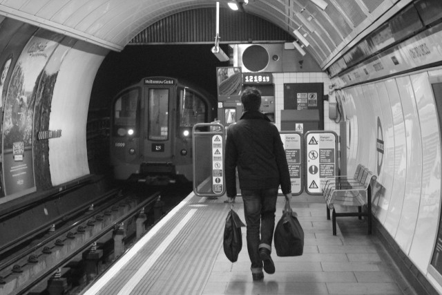 Man train station luggage black free wallpaper for desktop - medium preview image