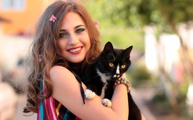 Woman smiling holding cat brown free wallpaper for desktop - medium preview image