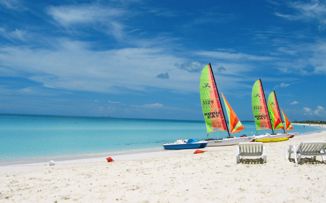 Sailboats beach chairs cloudy sky free wallpaper for desktop - medium preview image