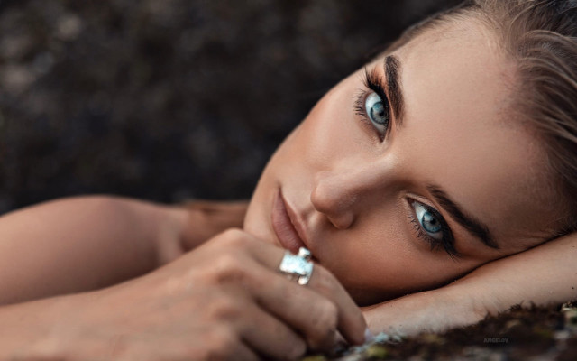 Woman laying blue eyes ring #3 free wallpaper for desktop - medium preview image
