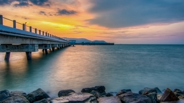 Long pier rocky beach sunset #3 free wallpaper for desktop - medium preview image