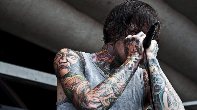 Man tattoos cellphone covering eyes free wallpaper for desktop - medium preview image