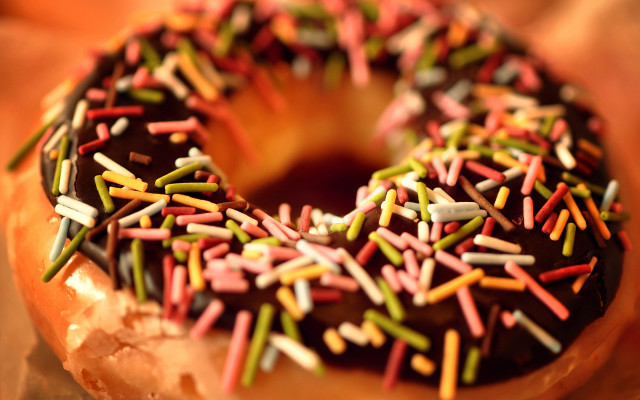 Chocolate donut sprinkles bite hyperrealism free wallpaper for desktop - medium preview image