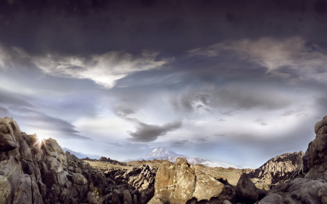 Mountain landscape rocks cloudy sky free wallpaper for desktop - medium preview image