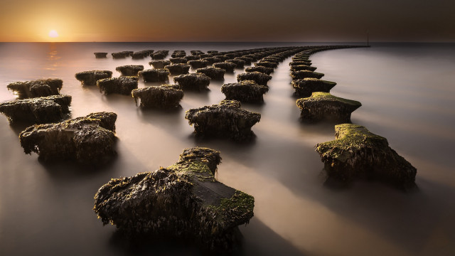 Sunset rocks water bridge cityscape free wallpaper for desktop - medium preview image