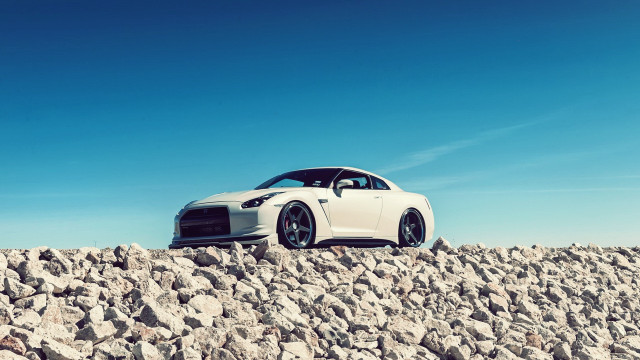 White car rocky surface tilt free wallpaper for desktop - medium preview image