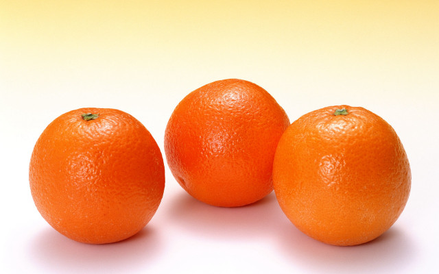 Three oranges white surface yellow free wallpaper for desktop - medium preview image