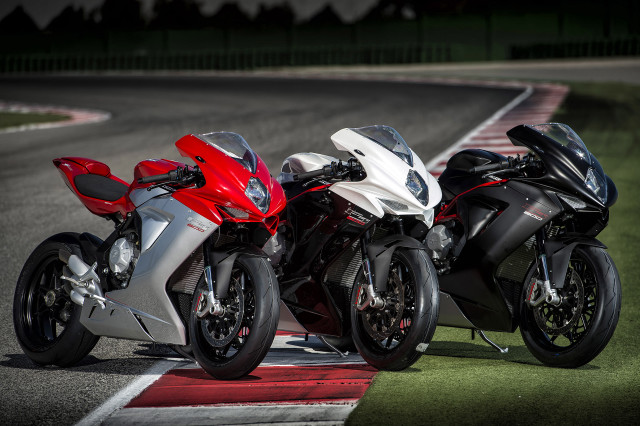 Three motorcycles race track night free wallpaper for desktop - medium preview image