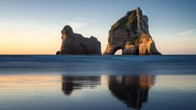 Rock formation reflection ocean sky free wallpaper for desktop - medium preview image
