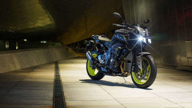 Motorcycle parked sidewalk building night free wallpaper for desktop - medium preview image