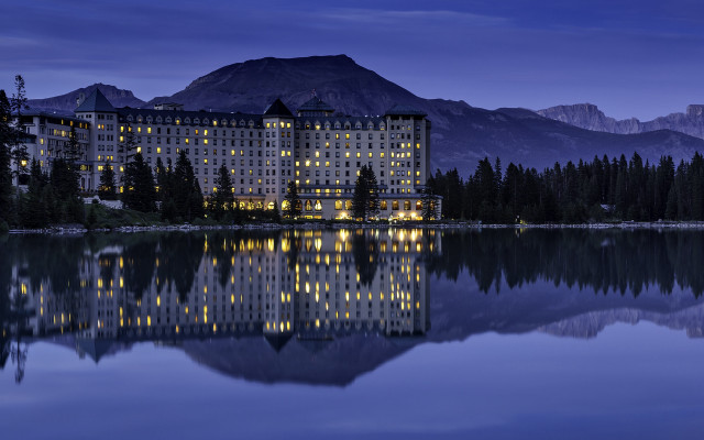 Large building lake mountains night free wallpaper for desktop - medium preview image