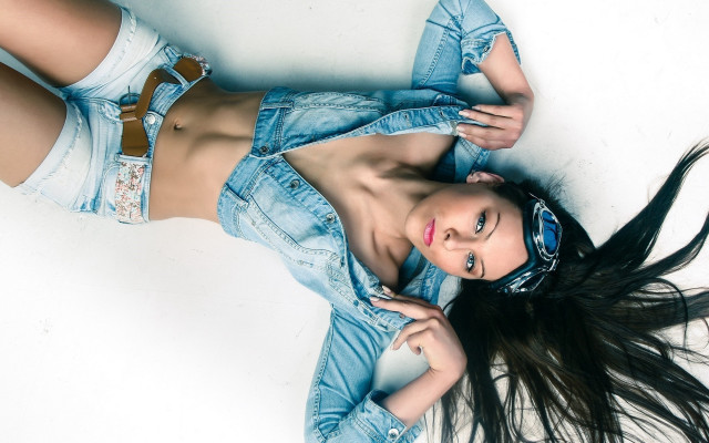 Woman jean jacket shorts laying free wallpaper for desktop - medium preview image