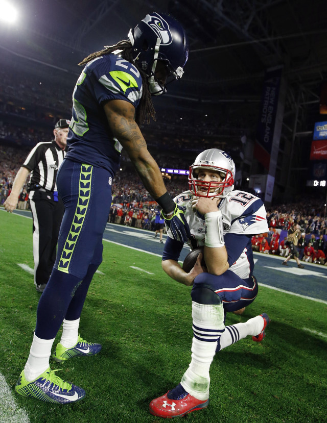 Football player helped off field free wallpaper for mobile - medium preview image