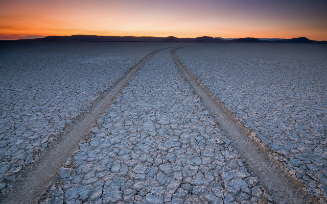 Desert sunset tracks mountains clouds free wallpaper for desktop - medium preview image