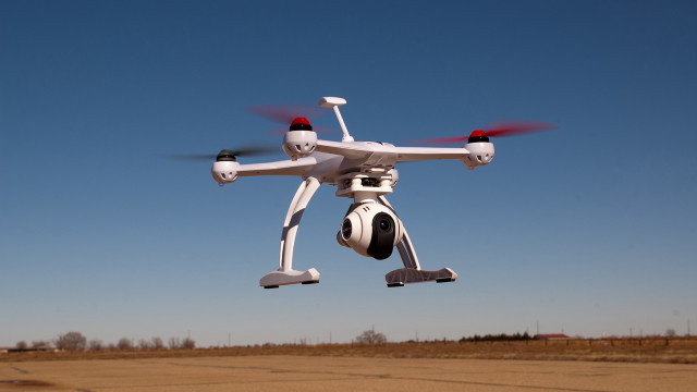 White black drone flying blue free wallpaper for desktop - medium preview image