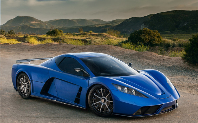 Blue sports car mountains cloudy free wallpaper for desktop - medium preview image