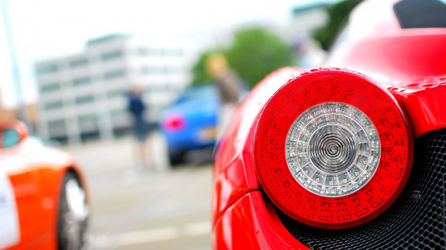 Red sports car person walking free wallpaper for desktop - medium preview image