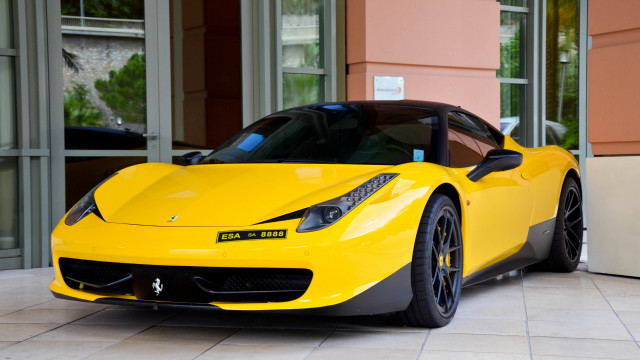 Yellow sports car building door free wallpaper for desktop - medium preview image