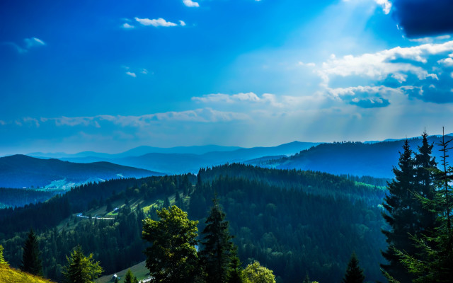 Mountain range trees clouds sunbeams free wallpaper for desktop - medium preview image