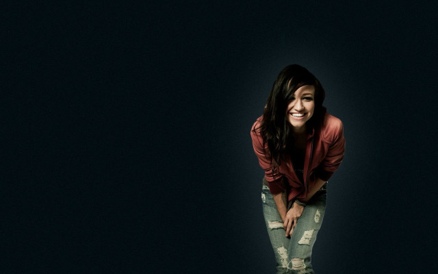 Woman smiling dark background jacket free wallpaper for desktop - medium preview image