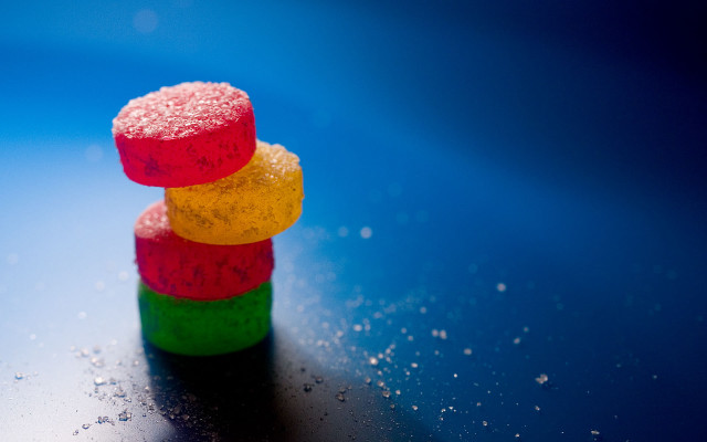 Colorful candies stack table blue free wallpaper for desktop - medium preview image