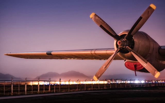 Propeller plane airport tarmac night free wallpaper for desktop - medium preview image