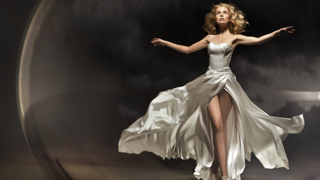 Woman white dress outstretched pose free wallpaper for desktop - medium preview image