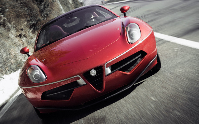Red sports car mountain side free wallpaper for desktop - medium preview image