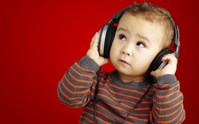 Young boy headphones listening music free wallpaper for desktop - medium preview image