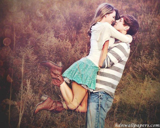 Couple hugging field grass flowers free wallpaper for desktop - medium preview image