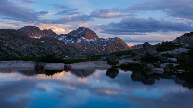 Mountain lake rocks snowy horizon free wallpaper for desktop - medium preview image