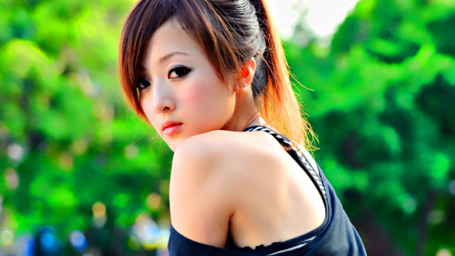 Woman ponytail black top posing free wallpaper for desktop - medium preview image