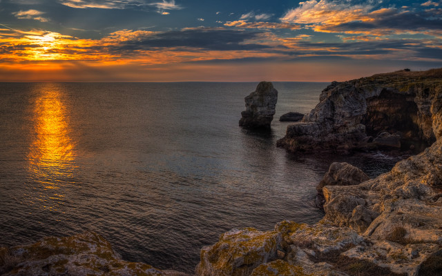 Sunset ocean rock formation shore free wallpaper for desktop - medium preview image