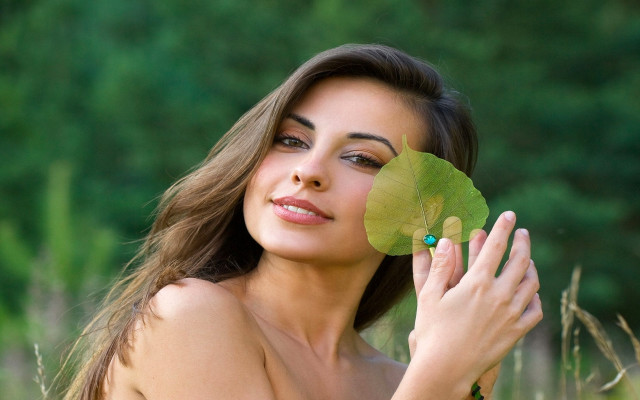 Woman holding leaf posing picture #2 free wallpaper for desktop - medium preview image